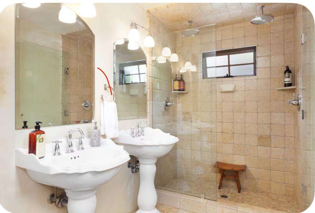 759 Rockaway Beach Avenue Pacifica, CA 94044 - Photo 17 of 20 a bathroom with a sink a mirror and a shower