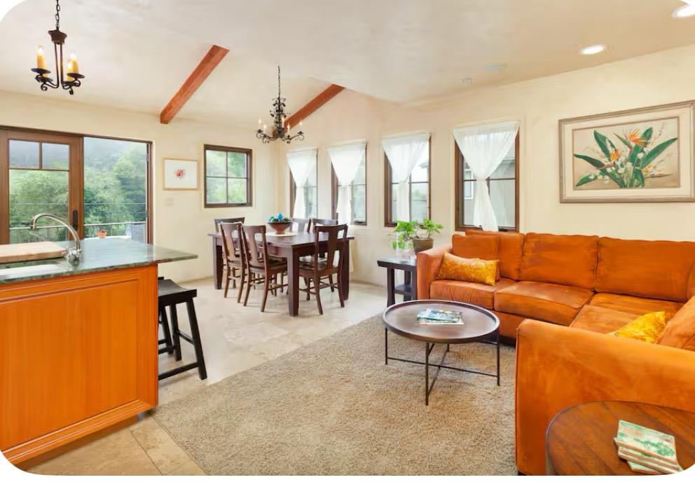 759 Rockaway Beach Avenue Pacifica, CA 94044 - Photo 3 of 20 a living room with furniture a large window and dining table