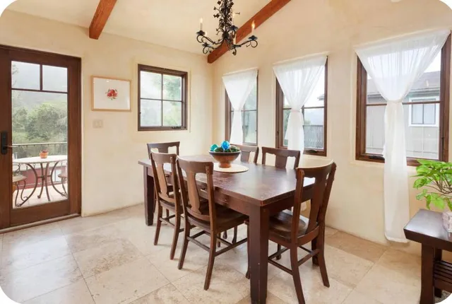 a living room with kitchen island furniture and a chandelier