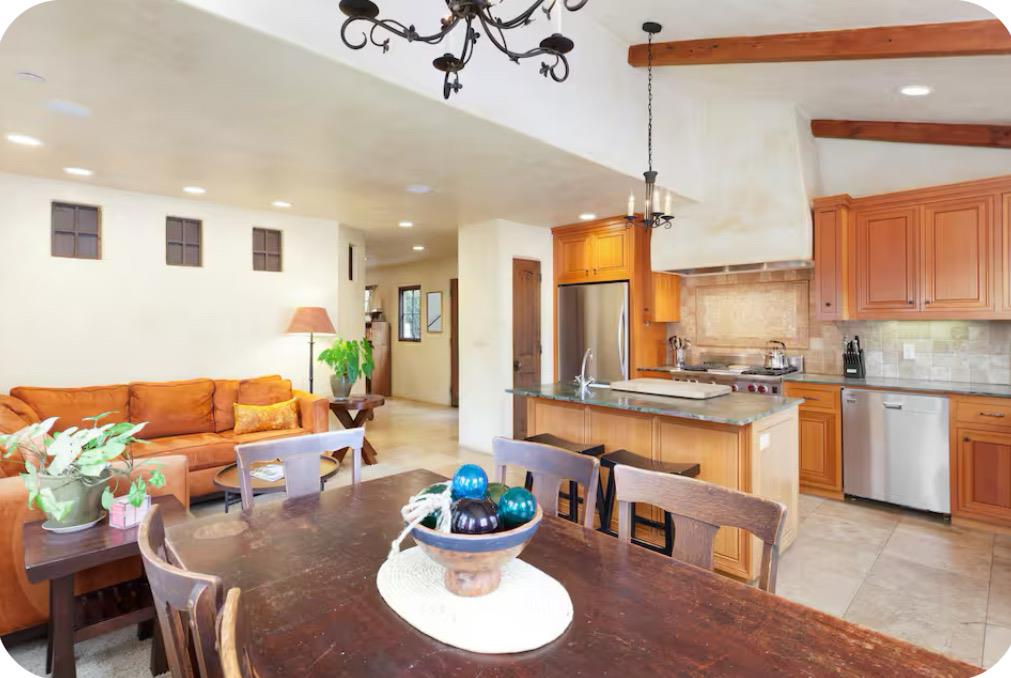 759 Rockaway Beach Avenue Pacifica, CA 94044 - Photo 5 of 20 a living room with kitchen island furniture and a chandelier