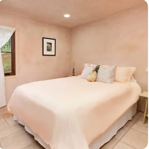 a bathroom with a granite countertop sink mirror and toilet