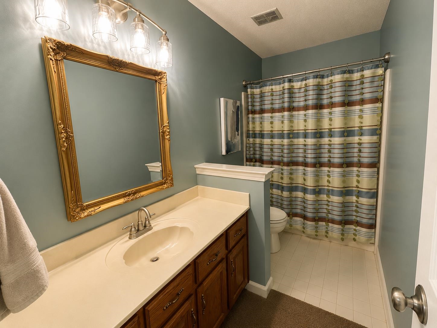 1946 Little John Road Millington, TN 38053 - Photo 11 of 20 Bathroom featuring a vanity with a light-toned countertop and a built-in sink