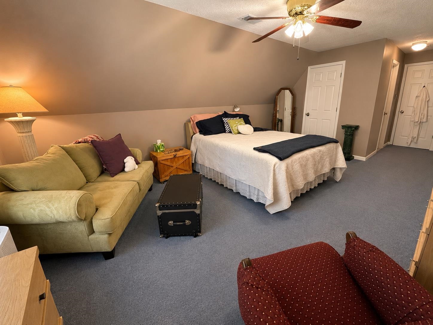 1946 Little John Road Millington, TN 38053 - Photo 12 of 20 Spacious room featuring sloped ceilings, plush blue carpeting, and a ceiling fan with light fixture