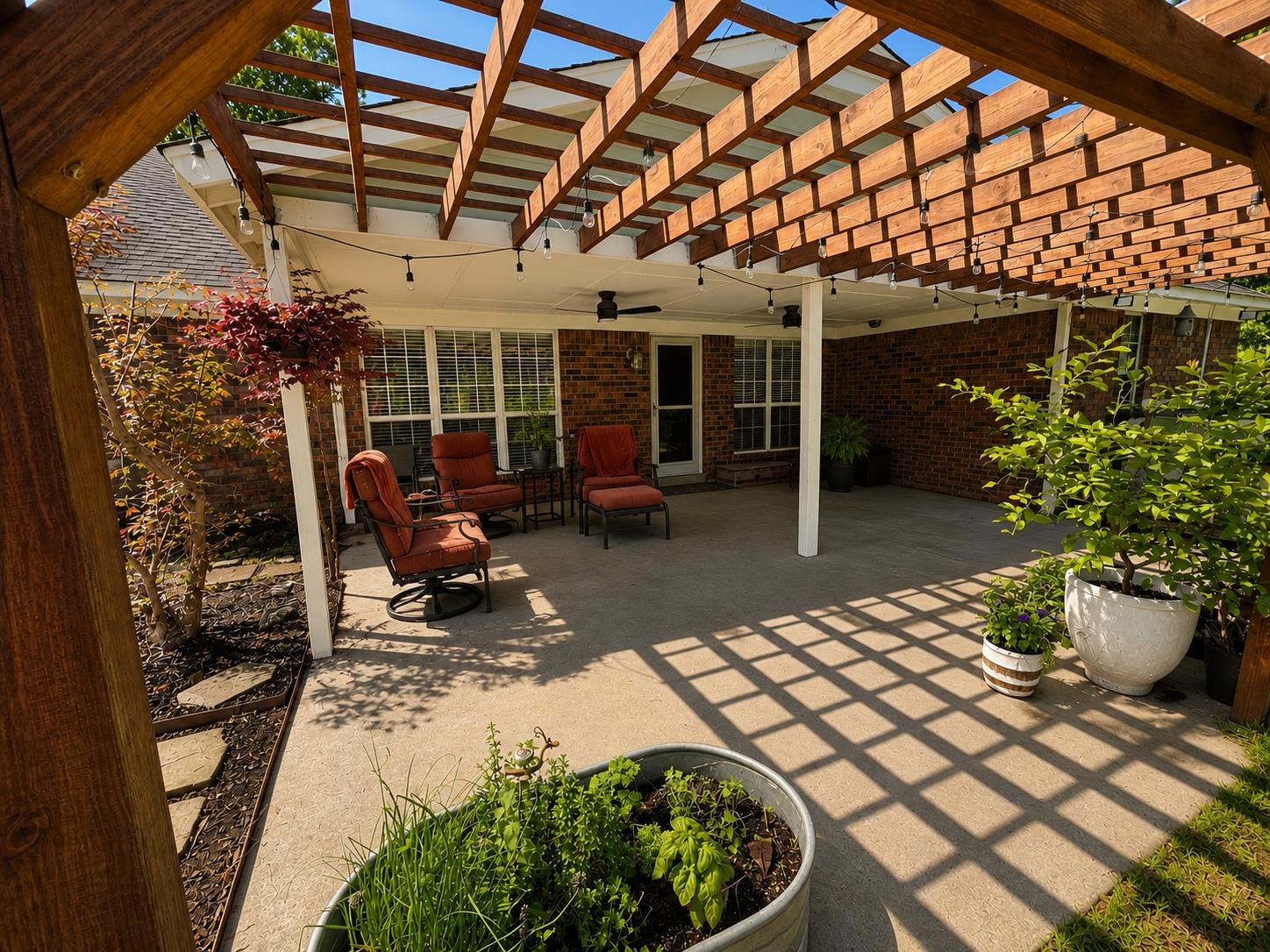1946 Little John Road Millington, TN 38053 - Photo 13 of 20 Outdoor patio featuring a wooden pergola, string lighting, and a ceiling fan