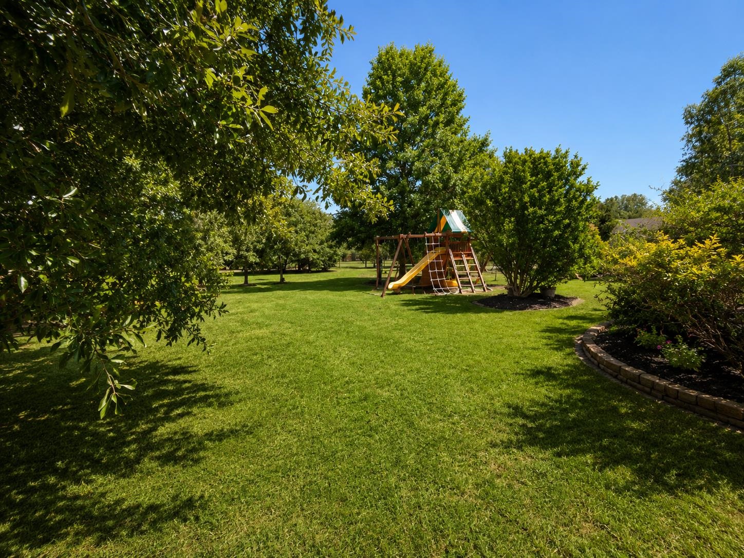 1946 Little John Road Millington, TN 38053 - Photo 17 of 20 Expansive lawn area featuring mature trees and established landscaping