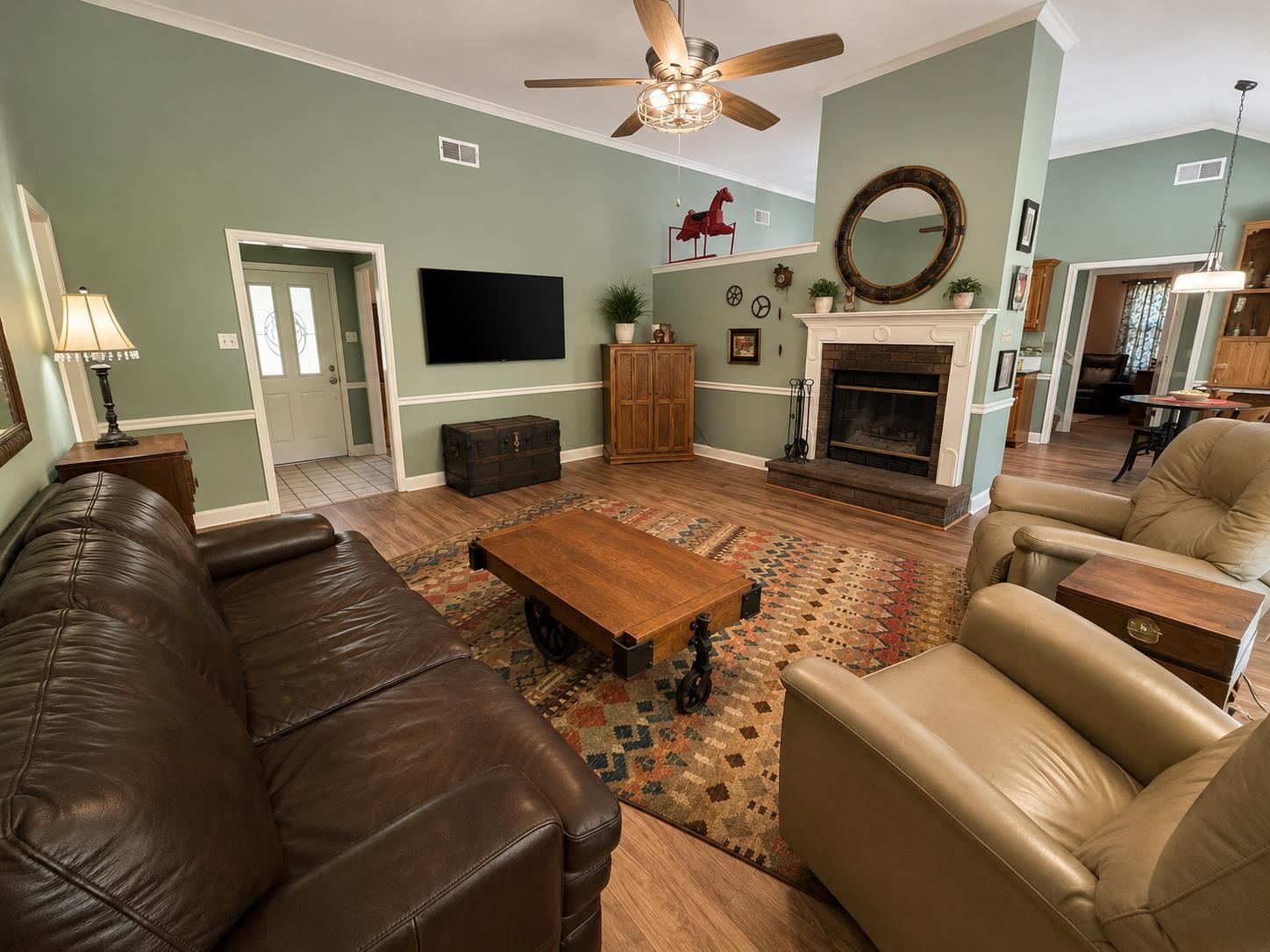 1946 Little John Road Millington, TN 38053 - Photo 2 of 20 Vaulted ceiling great room featuring wood-finish flooring and a ceiling fan