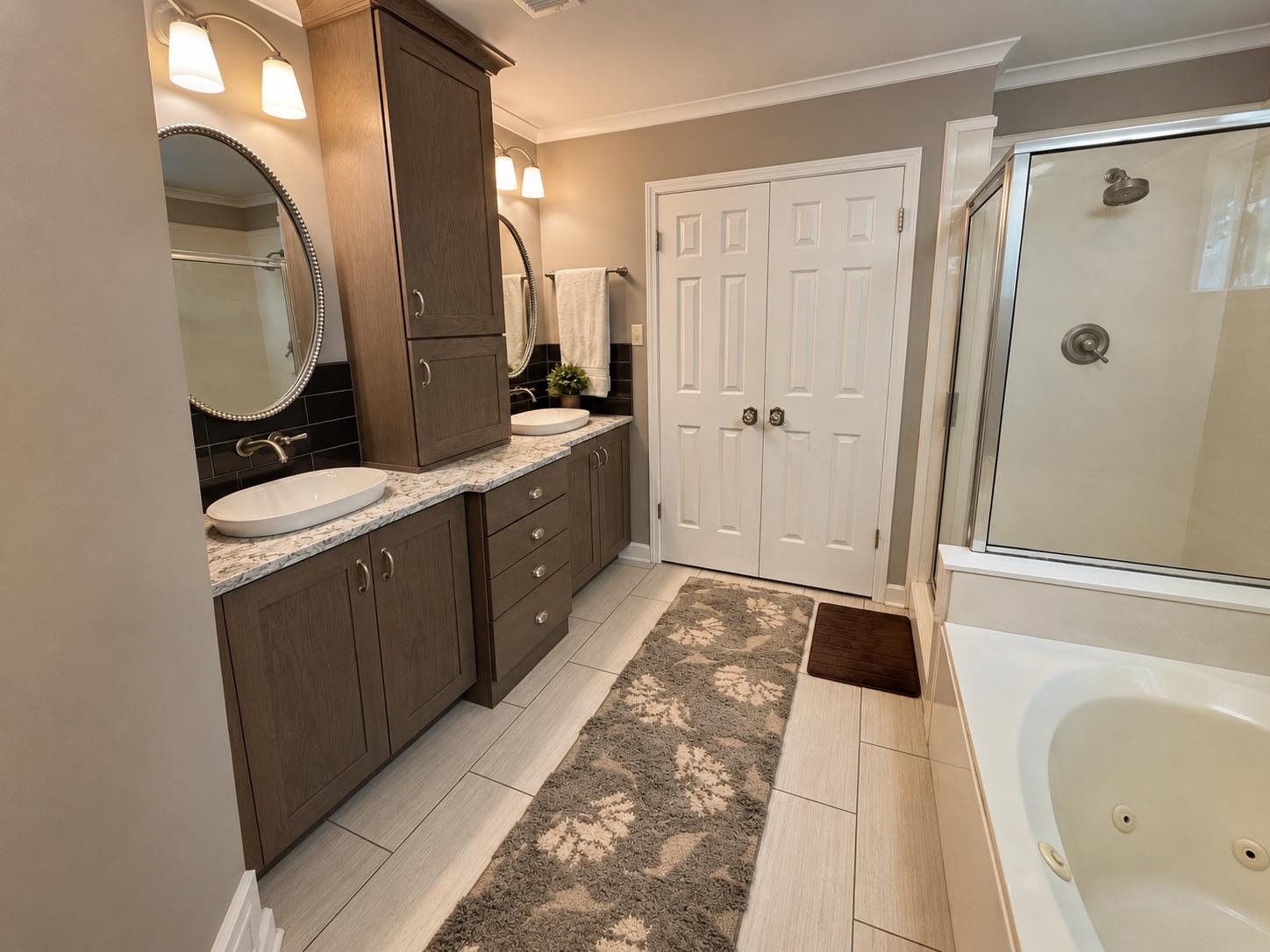 1946 Little John Road Millington, TN 38053 - Photo 5 of 20 Bathroom featuring dual vessel sinks with wall-mounted faucets, granite-style countertops, and dark cabinetry