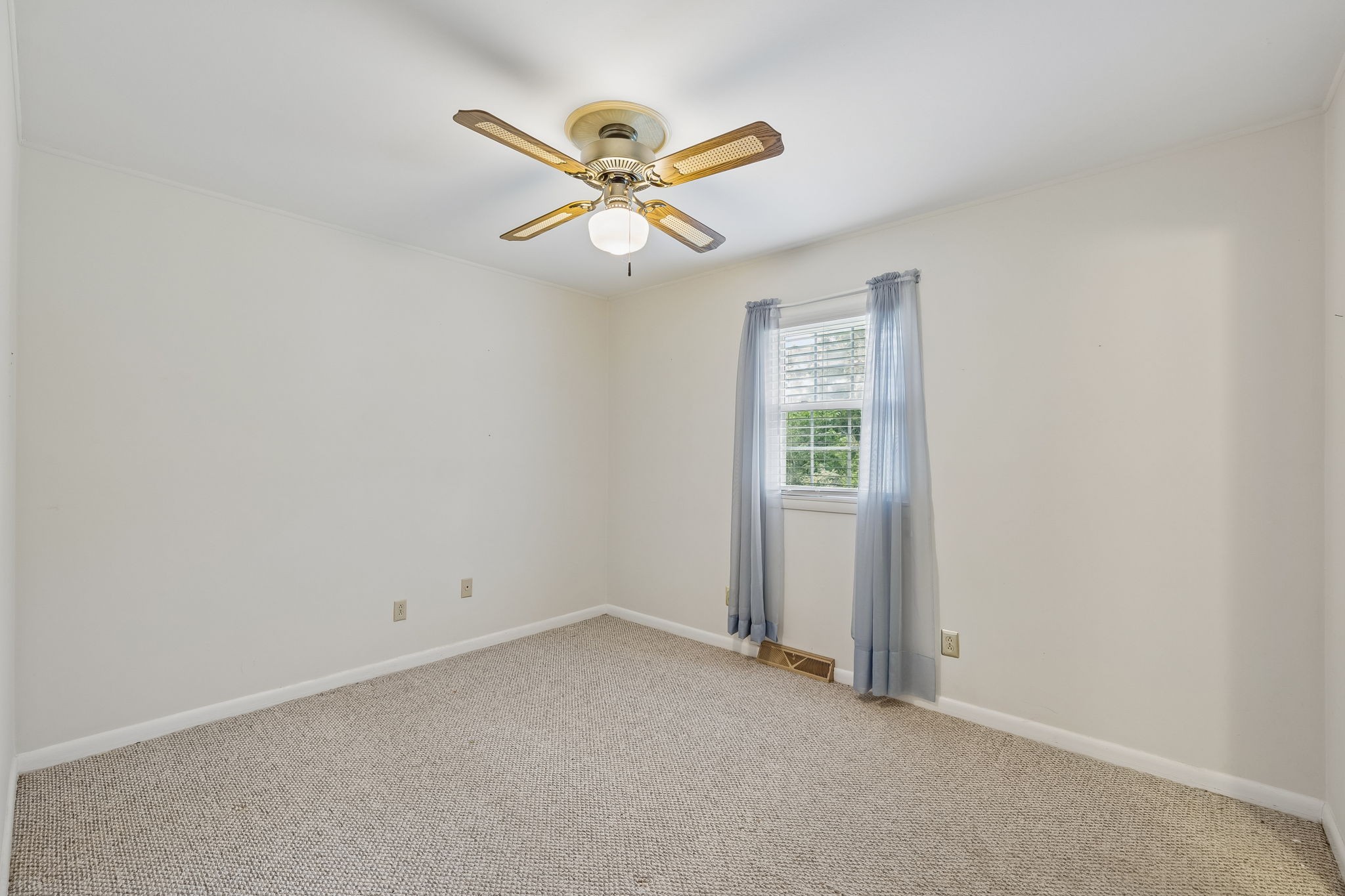 708 Hickory Street Centerville, TN 37033 - Photo 26 of 57 an empty room with windows and fan