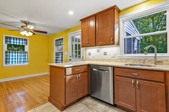 a kitchen with cabinets and window