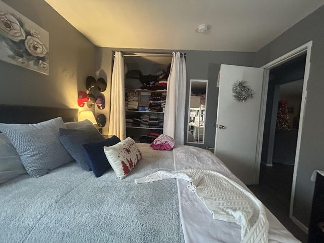 a living room with furniture and a bed