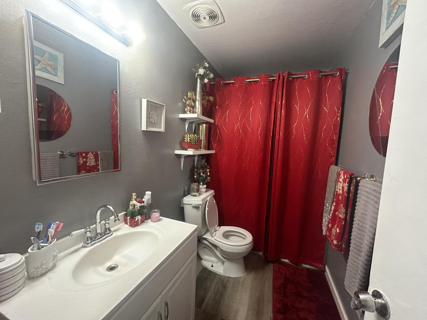 20 Marian Court San Rafael, CA 94901 - Photo 8 of 9 a bathroom with a sink mirror vanity and toilet