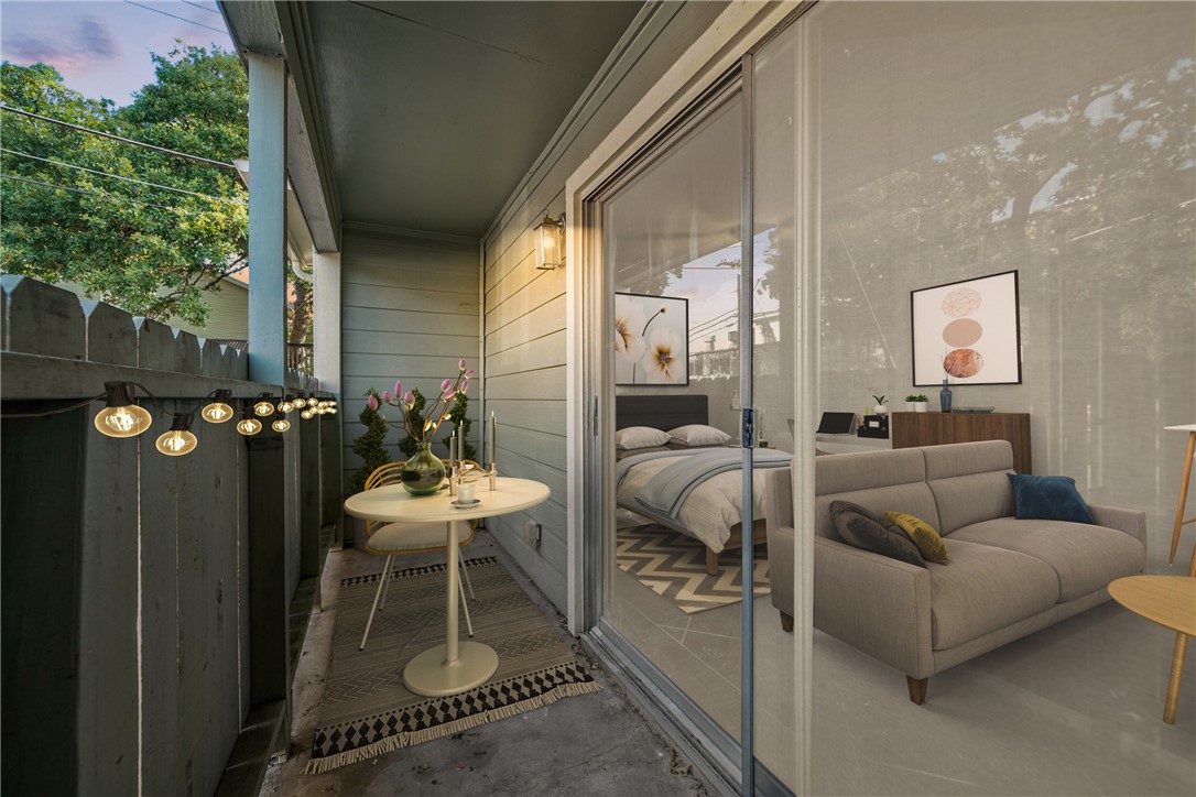 301 West 38th Street, Unit 106 Austin, TX 78705 - Photo 3 of 16 a balcony with furniture and a potted plant