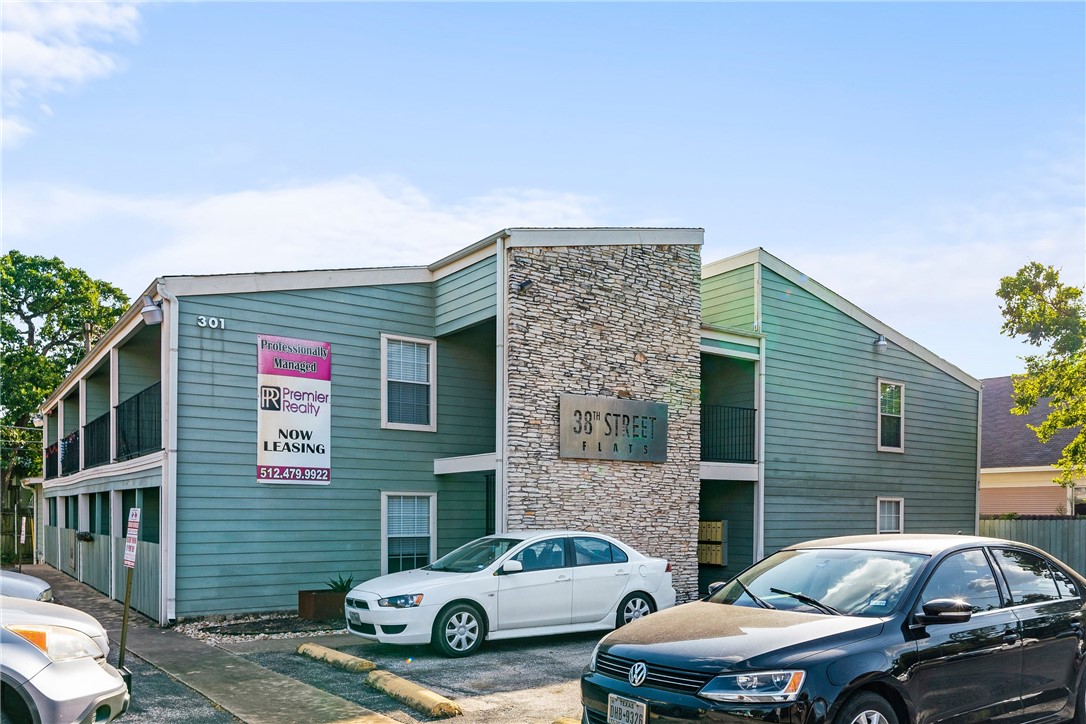 301 West 38th Street, Unit 106 Austin, TX 78705 - Photo 5 of 16 a front view of a house with parking space