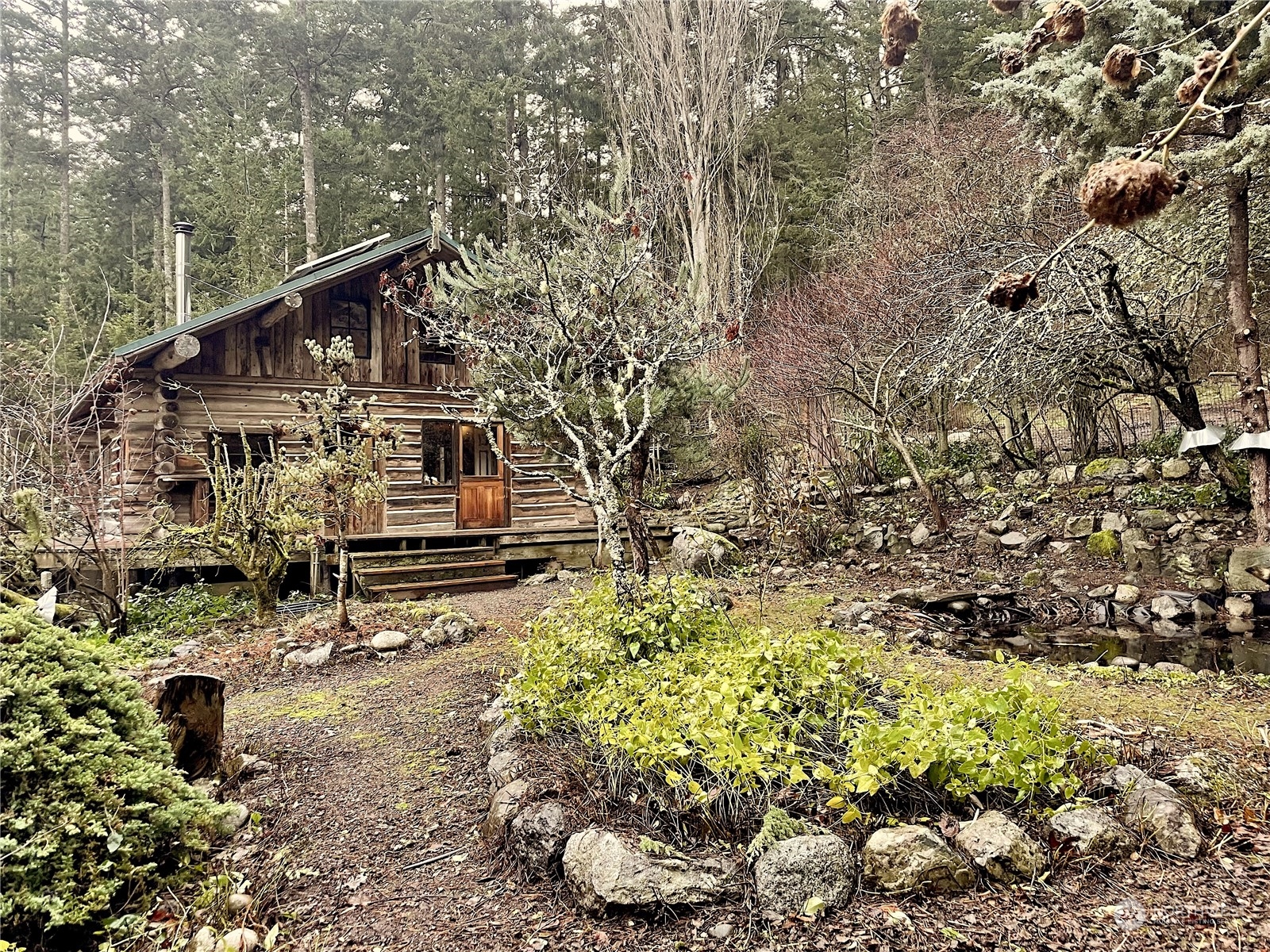549 White Beach Road Orcas Island, WA 98280 - Photo 23 of 38 a backyard of a house with lots of green space