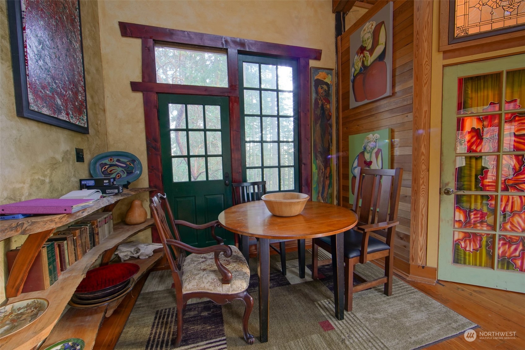 549 White Beach Road Orcas Island, WA 98280 - Photo 7 of 38 a view of a dining room with furniture and wooden floor