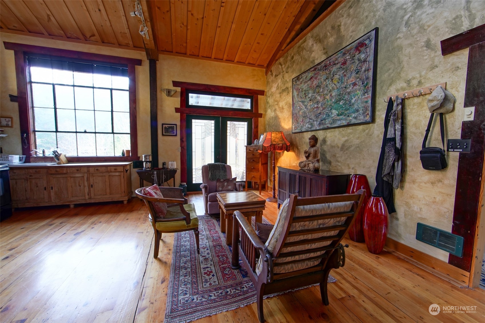 549 White Beach Road Orcas Island, WA 98280 - Photo 9 of 38 a view of a dining room with furniture window and wooden floor