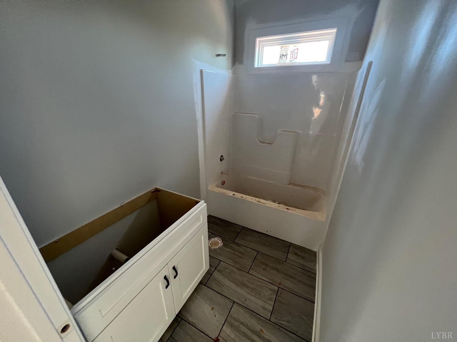 1222 Founding Way Road Bedford, VA 24523 - Photo 17 of 24 a bathroom with a sink and a mirror