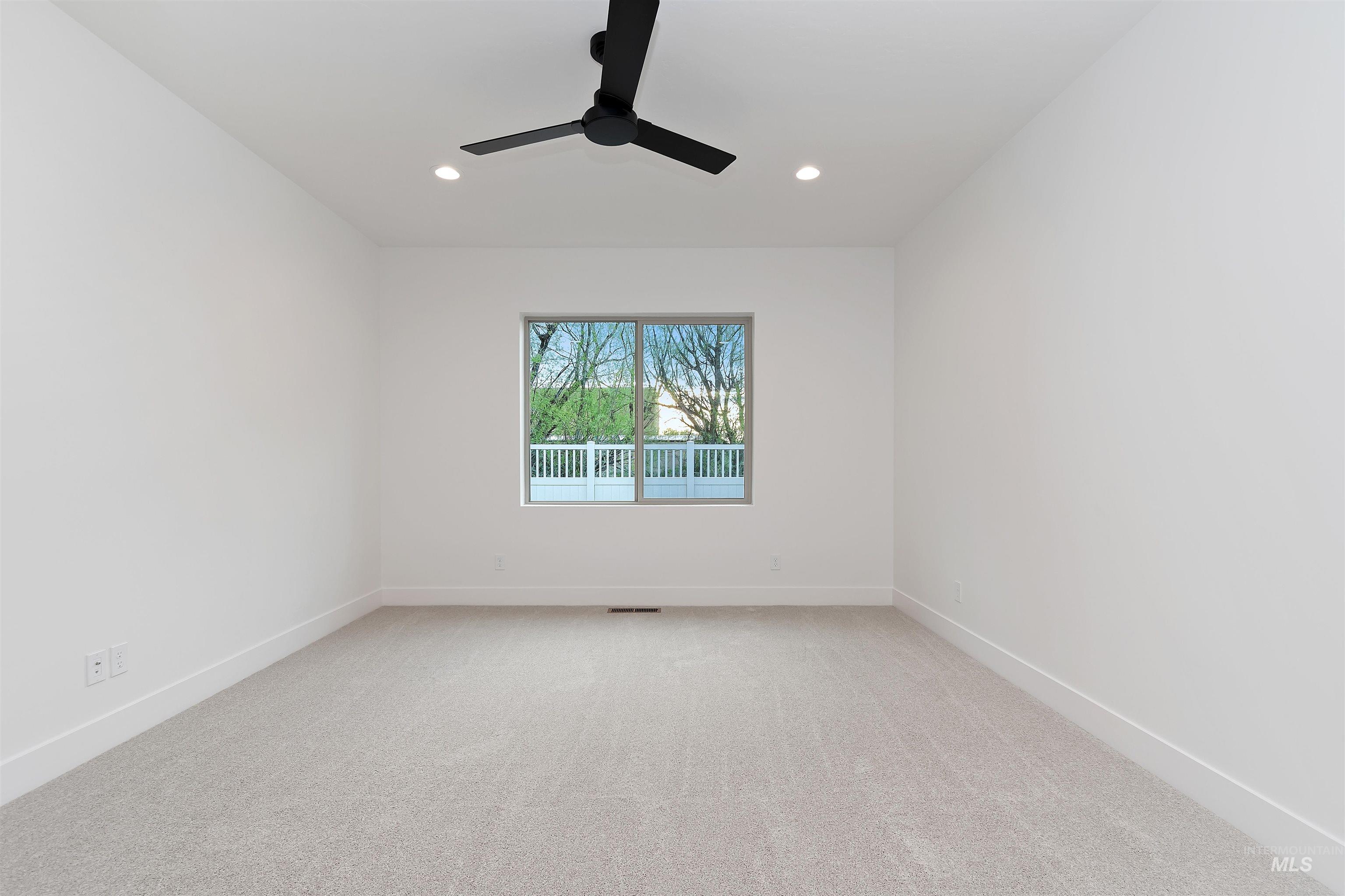 4302 Tropic Way Caldwell, ID 83607 - Photo 20 of 32 Unfurnished room featuring light carpet, a ceiling fan, and recessed lighting