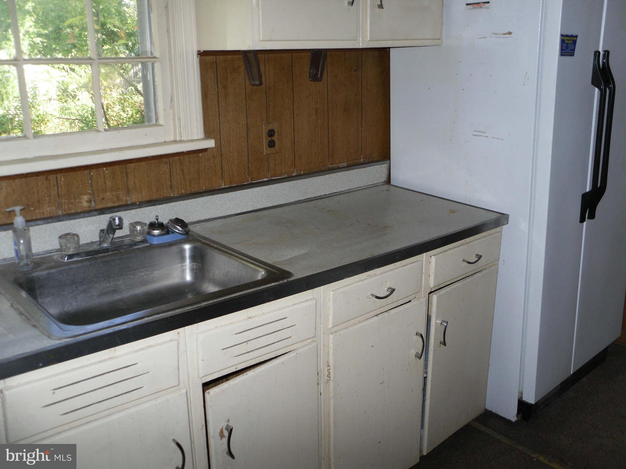 2407 Randolph Road Silver Spring, MD 20906 - Photo 6 of 6 a kitchen with a sink and cabinets