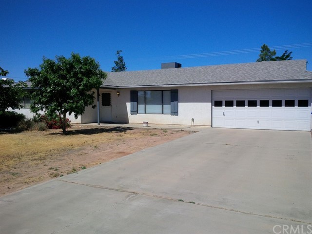 13428 Yakima Road Apple Valley, CA 92308 - Photo 1 of 1 a view of a street with a building in front of it