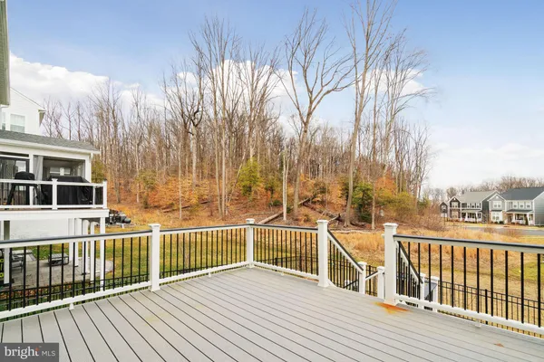 a view of a house with wooden deck
