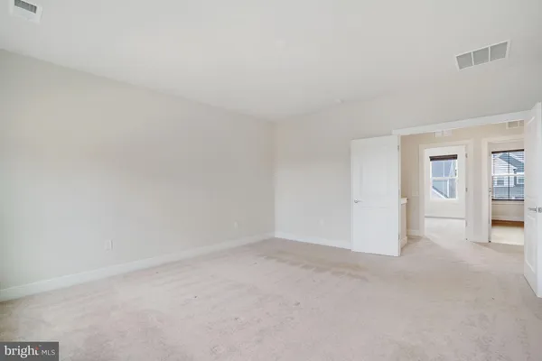a bathroom with double sink and a mirror