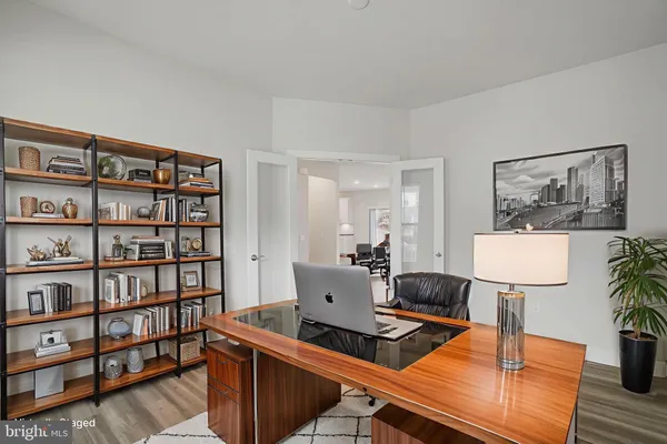 a living room with furniture and a lamp