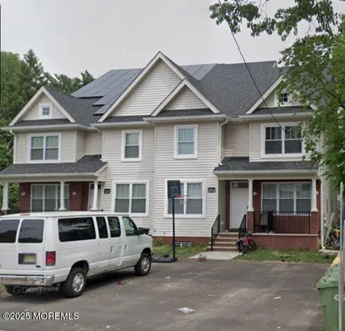 a car parked in front of a house