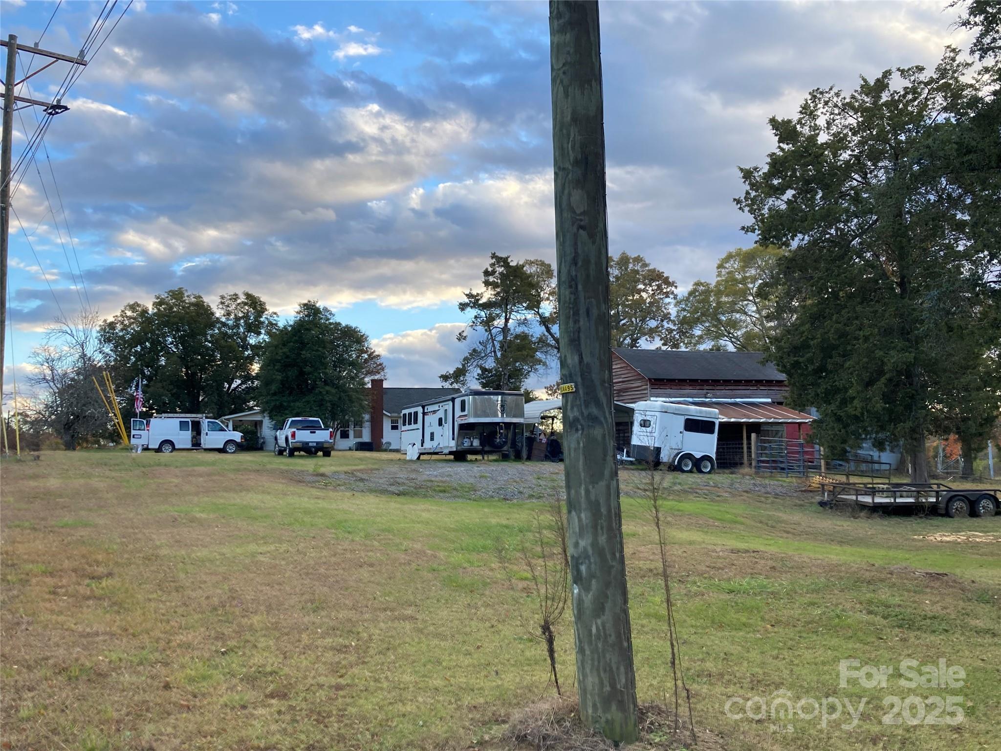 1075 Bostian Road China Grove, NC 28023 - Photo 14 of 25 a view of a house with a big yard and large trees