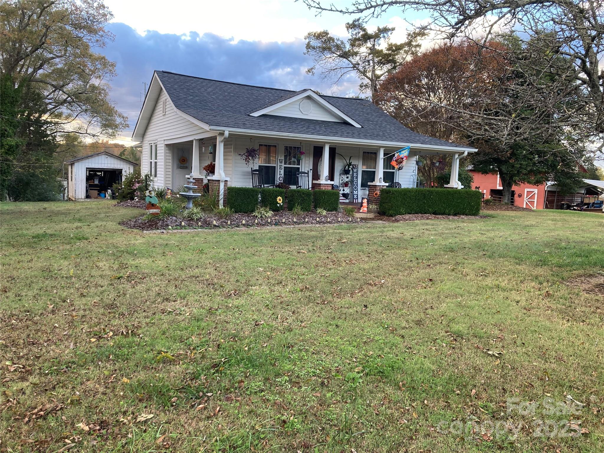 1075 Bostian Road China Grove, NC 28023 - Photo 22 of 25 a front view of a house with a yard