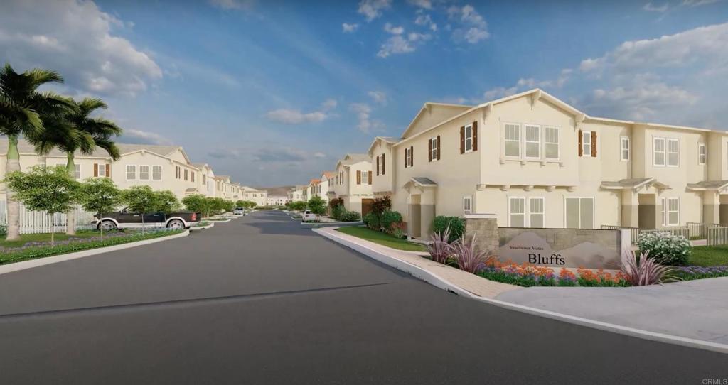 a view of a street with a house in the background