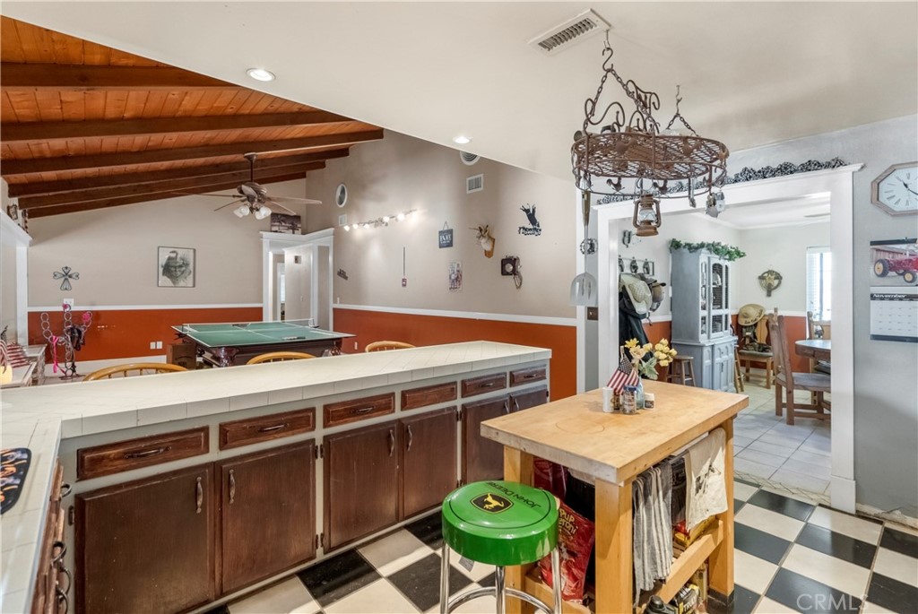 172 Eighth Street Norco, CA 92860 - Photo 11 of 55 a kitchen with stainless steel appliances a stove a chimney a sink and cabinets