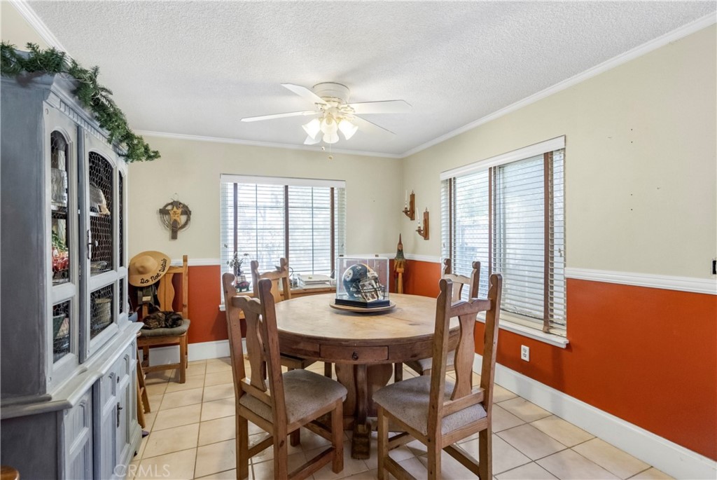 172 Eighth Street Norco, CA 92860 - Photo 12 of 55 a dining room with furniture a chandelier and window
