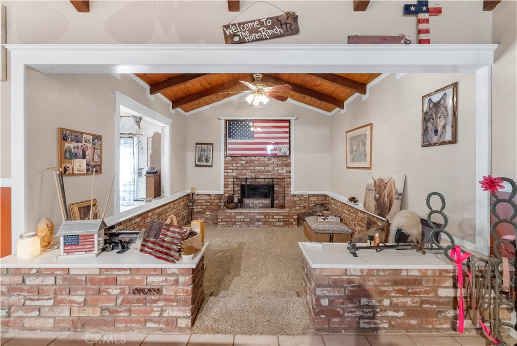 172 Eighth Street Norco, CA 92860 - Photo 13 of 55 a living room with furniture and a fireplace
