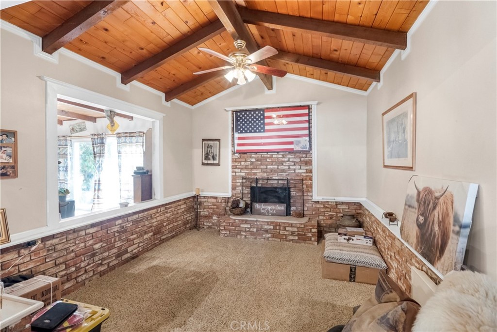 172 Eighth Street Norco, CA 92860 - Photo 14 of 55 a living room with furniture and a fireplace