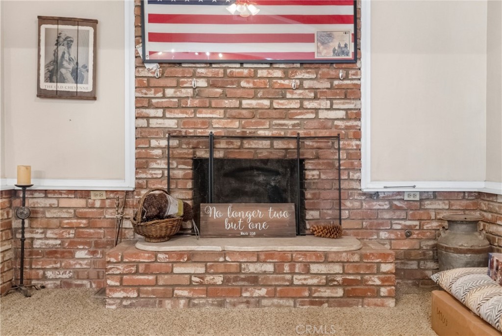 172 Eighth Street Norco, CA 92860 - Photo 15 of 55 a living room with a fireplace