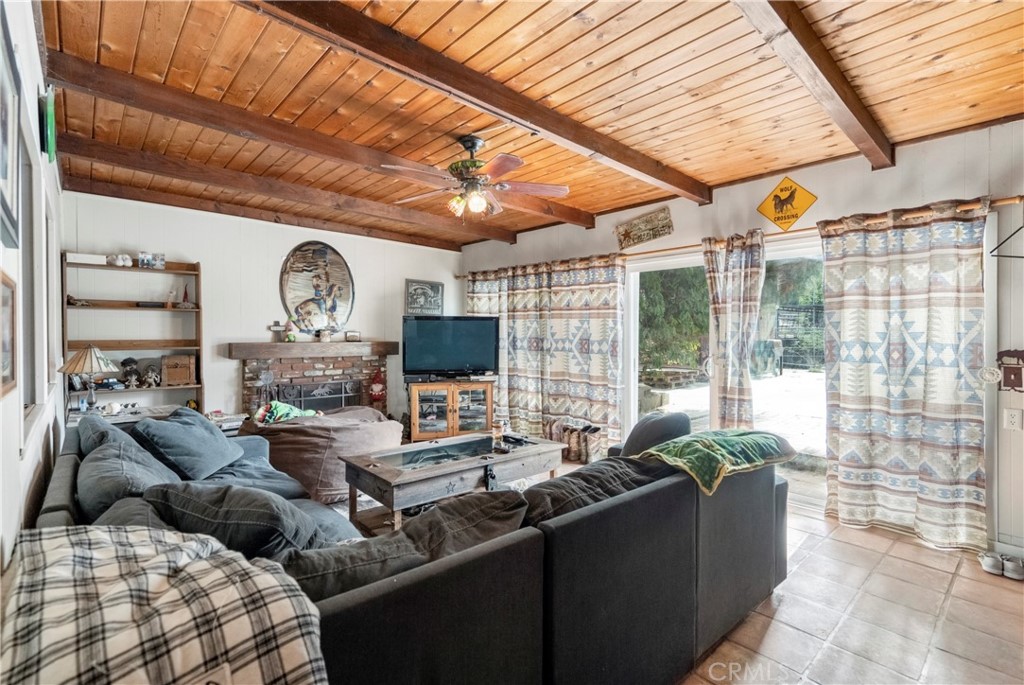 172 Eighth Street Norco, CA 92860 - Photo 17 of 55 a living room with fireplace furniture and a large window
