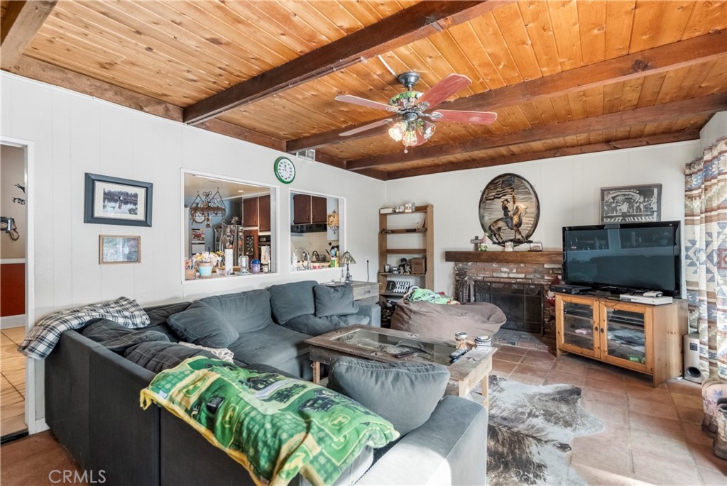 172 Eighth Street Norco, CA 92860 - Photo 18 of 55 a living room with furniture and a flat screen tv
