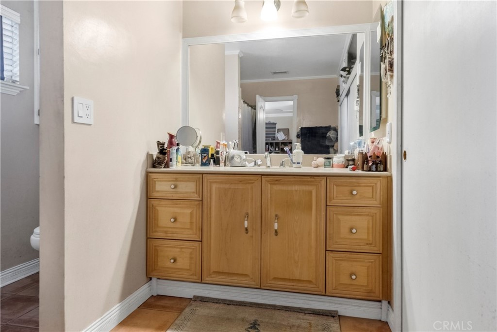 172 Eighth Street Norco, CA 92860 - Photo 23 of 55 a bathroom with a sink vanity and mirror