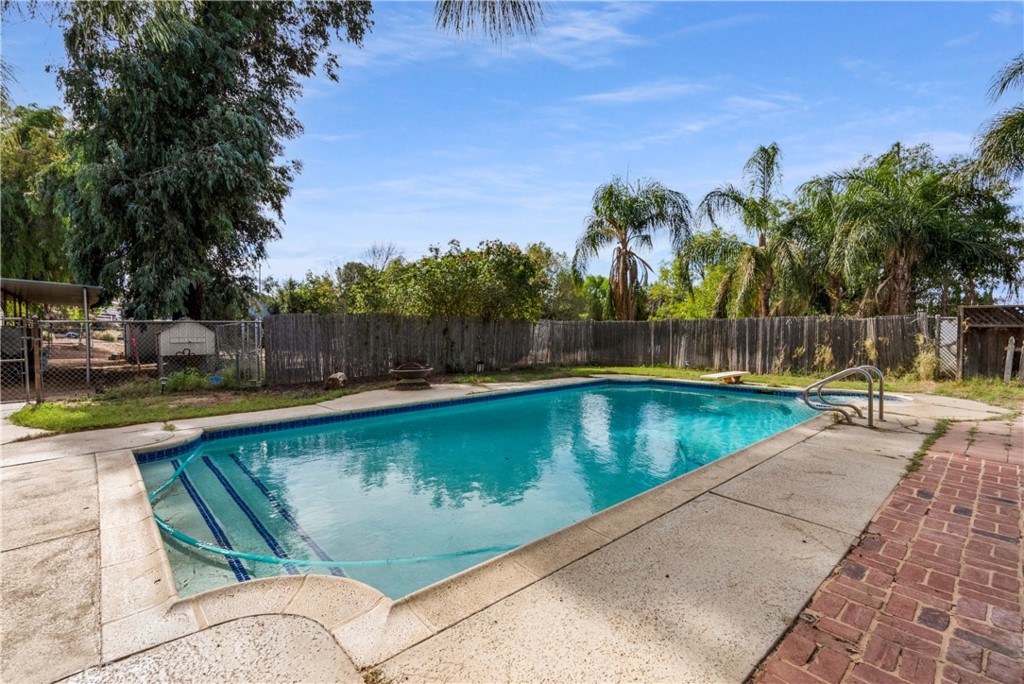 172 Eighth Street Norco, CA 92860 - Photo 25 of 55 swimming pool with outdoor seating and yard