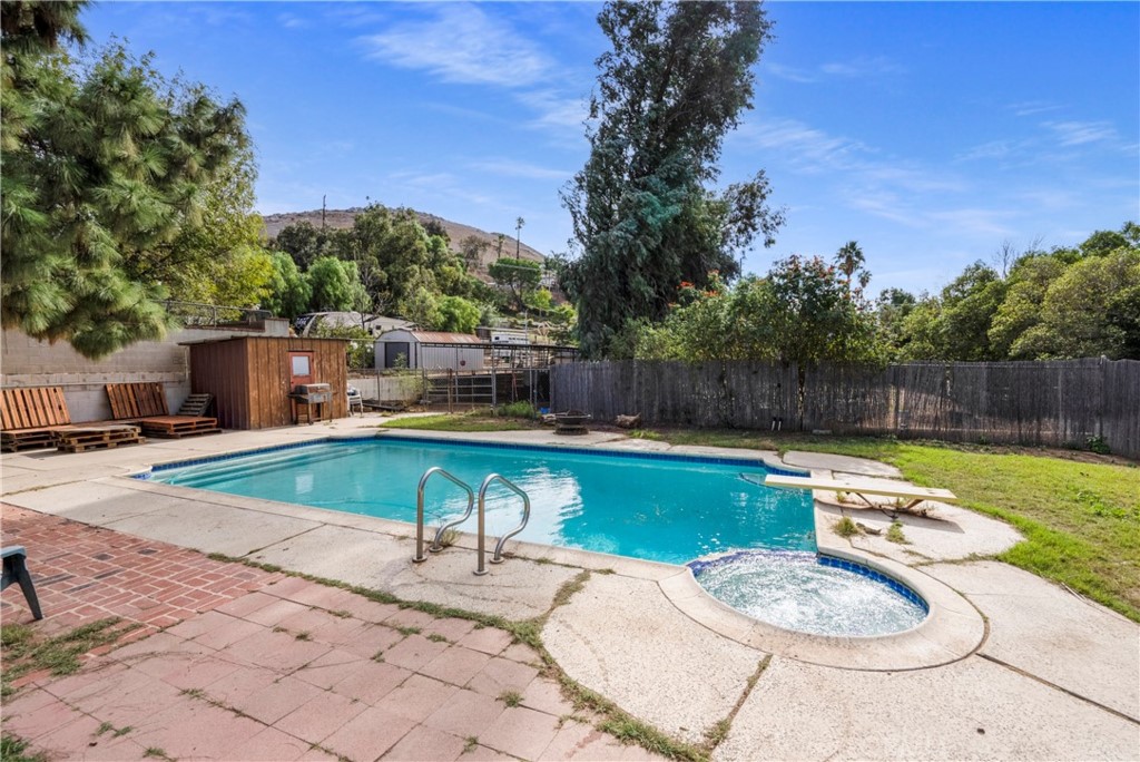 172 Eighth Street Norco, CA 92860 - Photo 28 of 55 a view of a swimming pool with a patio