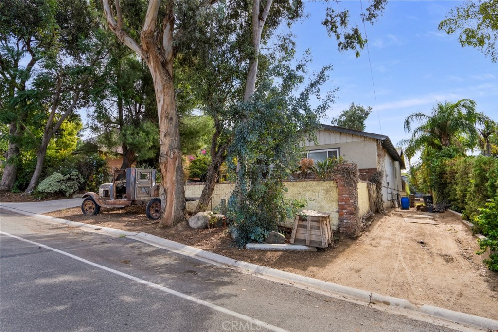 172 Eighth Street Norco, CA 92860 - Photo 38 of 55 a view of a patio with wooden fence and a tree