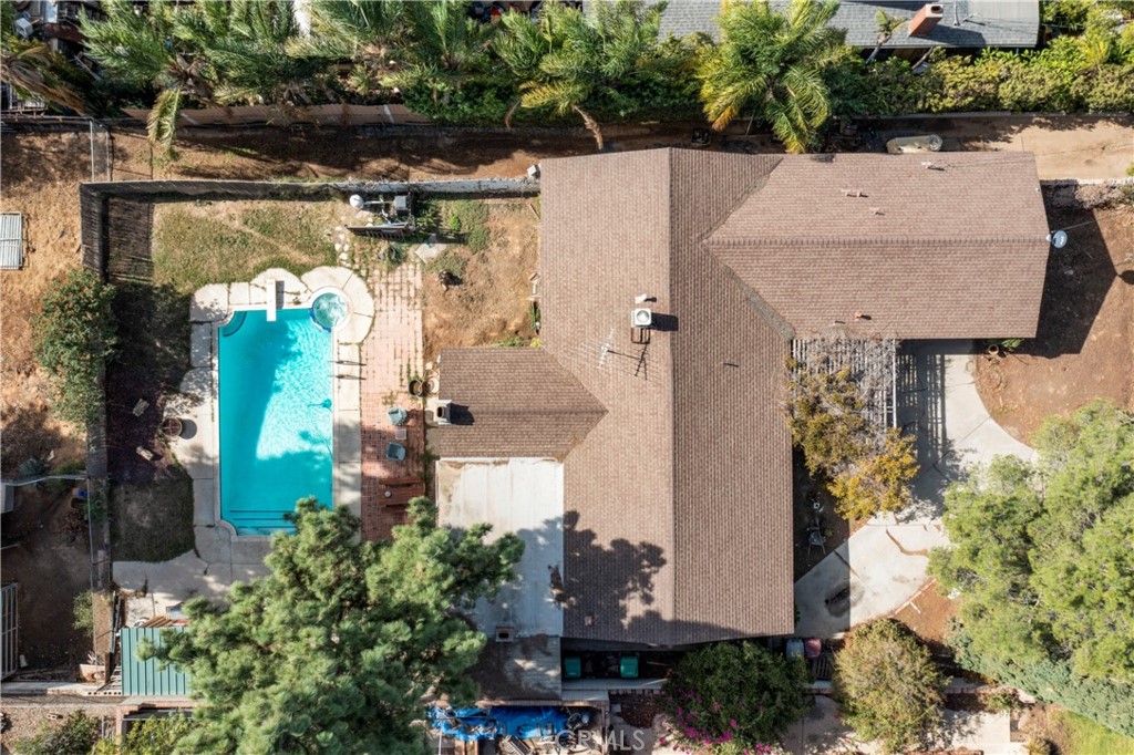172 Eighth Street Norco, CA 92860 - Photo 43 of 55 an aerial view of a house with a swimming pool and outdoor seating