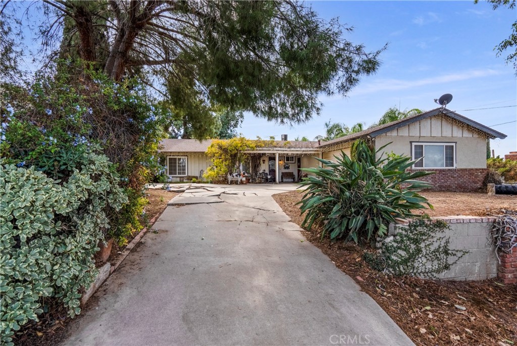 172 Eighth Street Norco, CA 92860 - Photo 44 of 55 a view of house with outdoor space and trees around