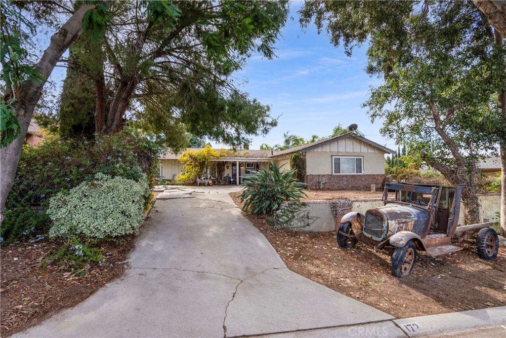172 Eighth Street Norco, CA 92860 - Photo 48 of 55 a view of house with outdoor seating and covered with trees