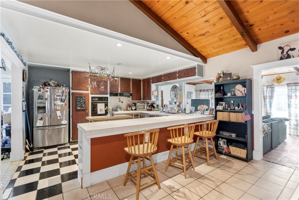 172 Eighth Street Norco, CA 92860 - Photo 8 of 55 a large white kitchen with a table and chairs