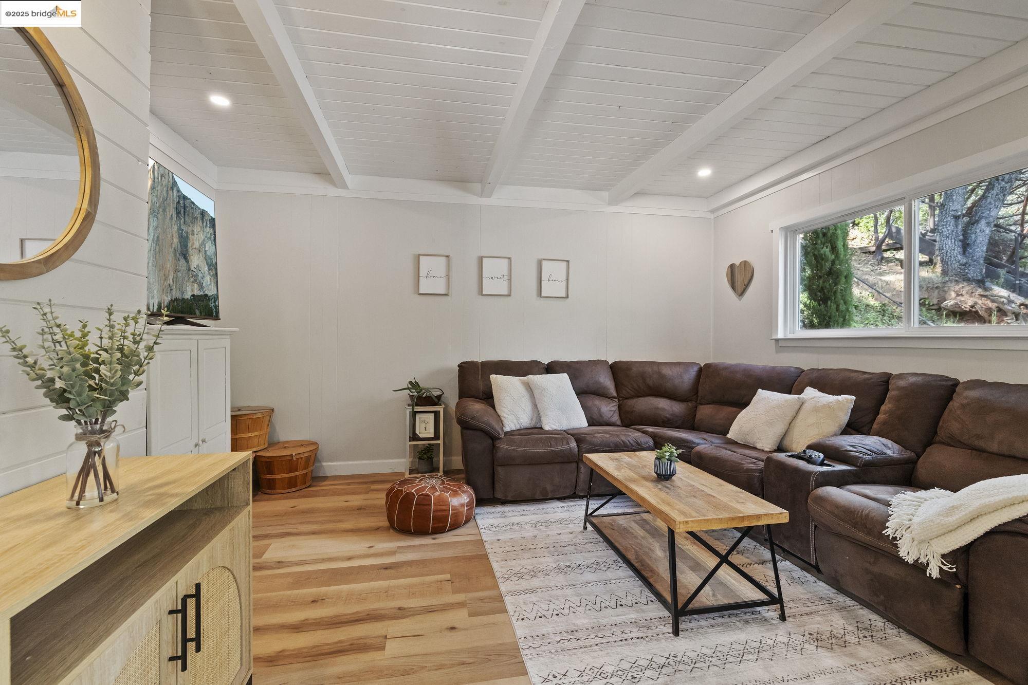 20638 Maranatha Road Tuolumne, CA 95379 - Photo 17 of 60 a living room with furniture a large window and a wooden floor