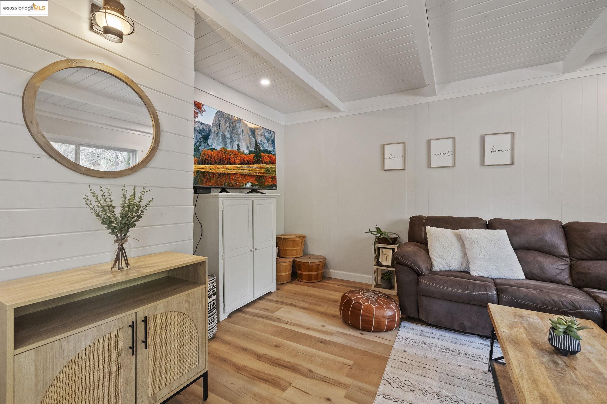 20638 Maranatha Road Tuolumne, CA 95379 - Photo 18 of 60 a living room with furniture and a wooden floor