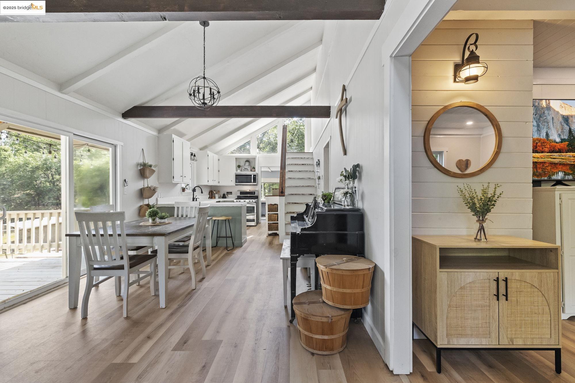 20638 Maranatha Road Tuolumne, CA 95379 - Photo 20 of 60 a view of a dining room with furniture window and wooden floor