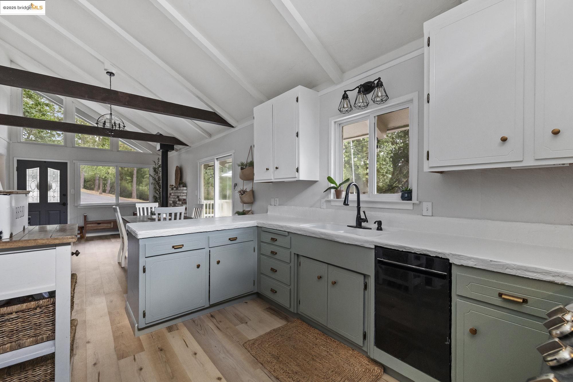 20638 Maranatha Road Tuolumne, CA 95379 - Photo 28 of 60 a kitchen with a sink stove and cabinets